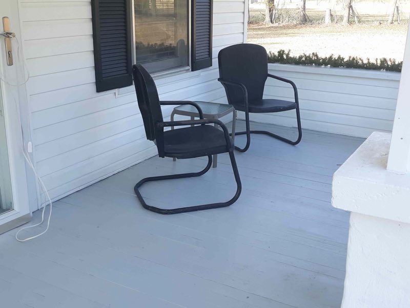 Finished front porch with a freshly painted gray floor